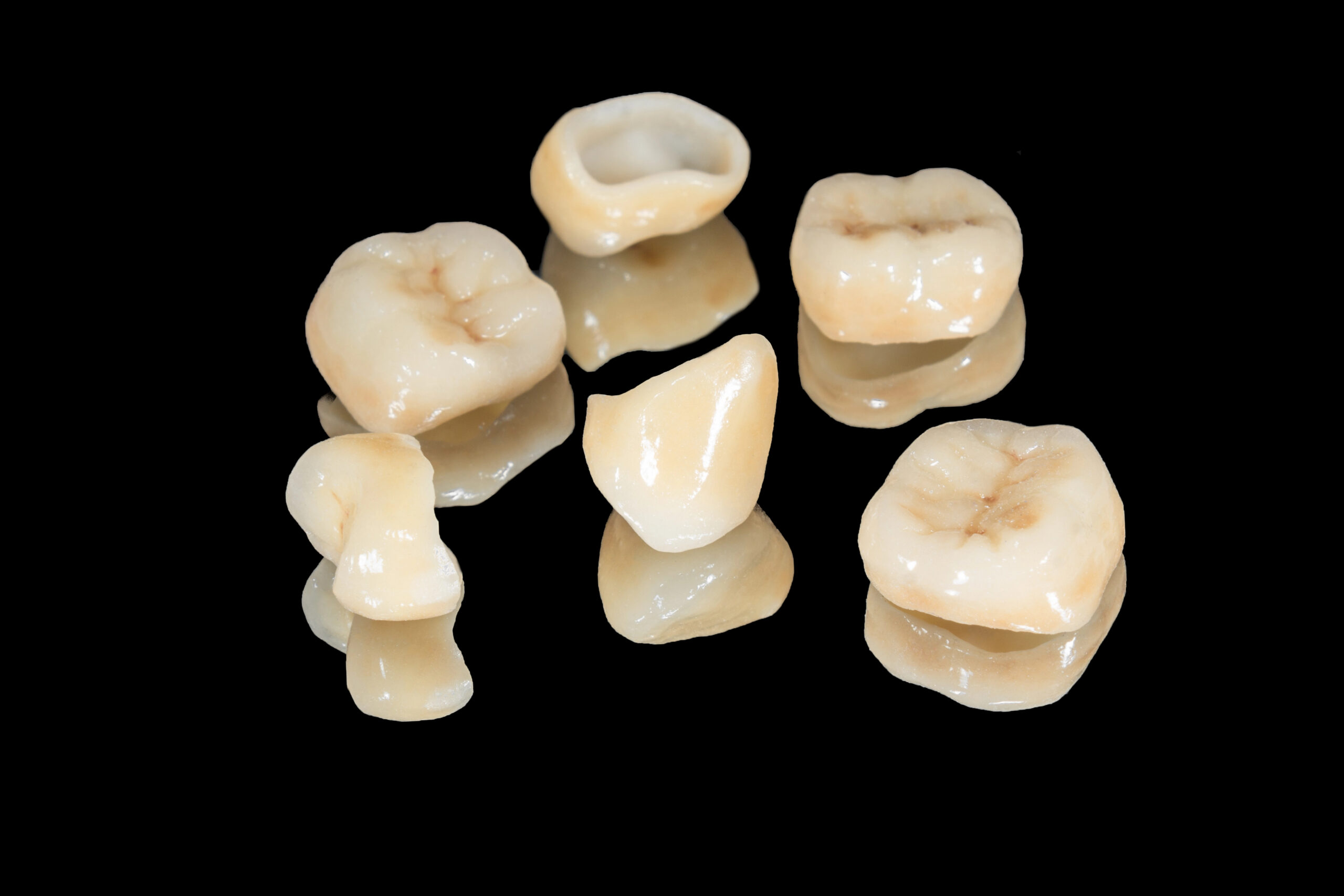 zirconium dental crowns isolated on black background